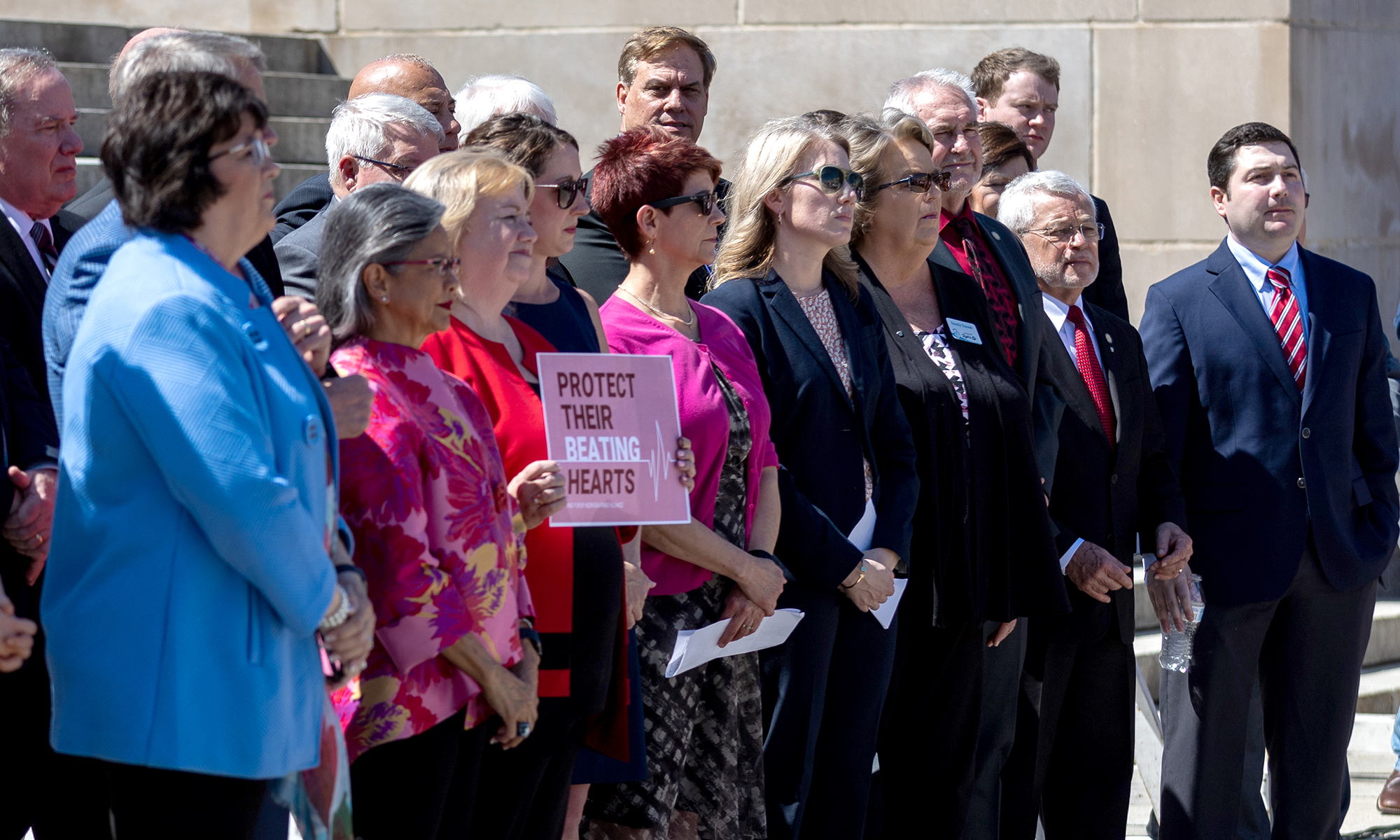 Nebraska legislators pose with anti-abortion advocates at a rally on the north steps of the state Capitol in support of a bill to ban abortion at about six weeks. That measure failed to advance, but lawmakers did pass a 12-week ban. (Photo by Joseph Kual Zakaria/News21)
