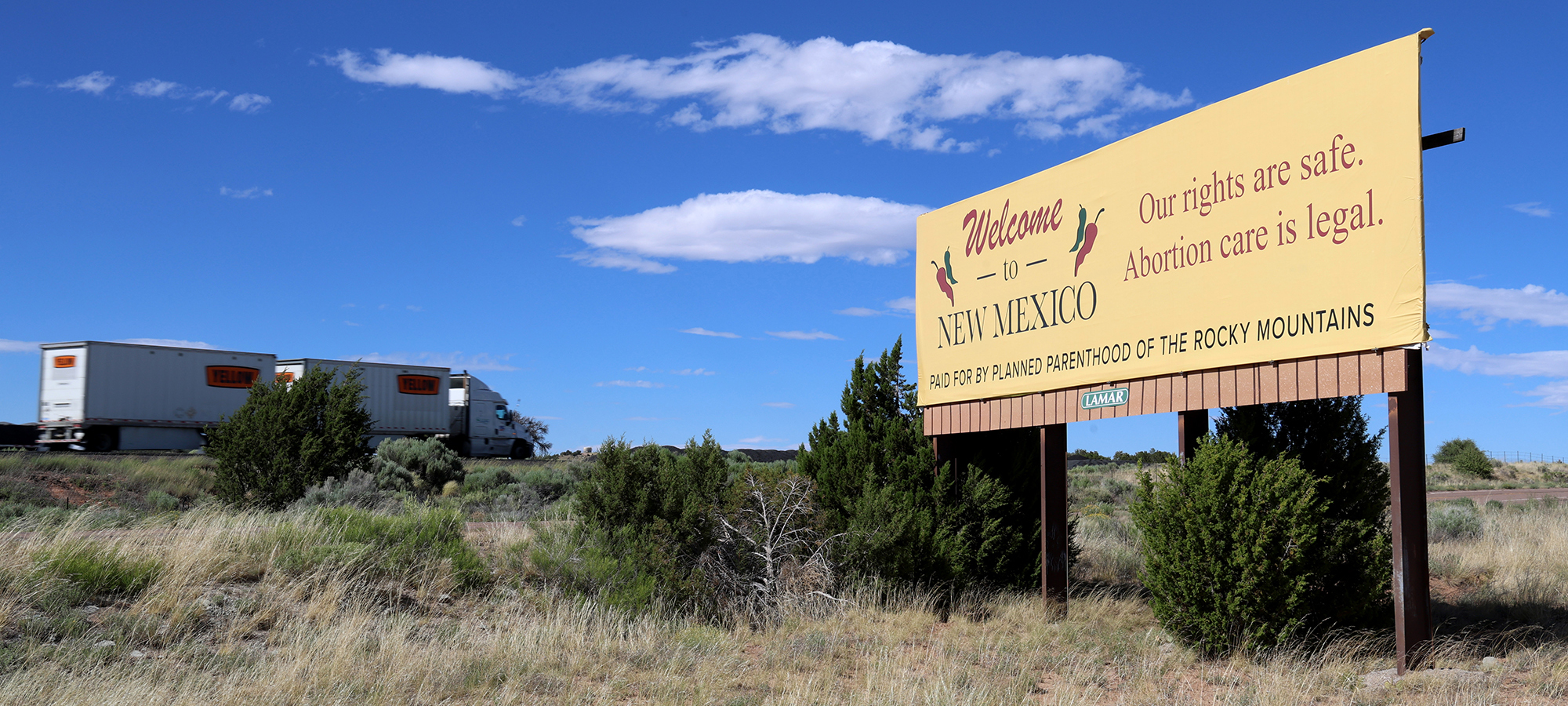 A Planned Parenthood of the Rocky Mountains billboard welcomes motorists to New Mexico with a message that reads: “Our rights are safe. Abortion care is legal.” As more states pass abortion bans, providers and patients have flocked to New Mexico, a sanctuary for abortion rights. (Photo by Noel Lyn Smith/News21)