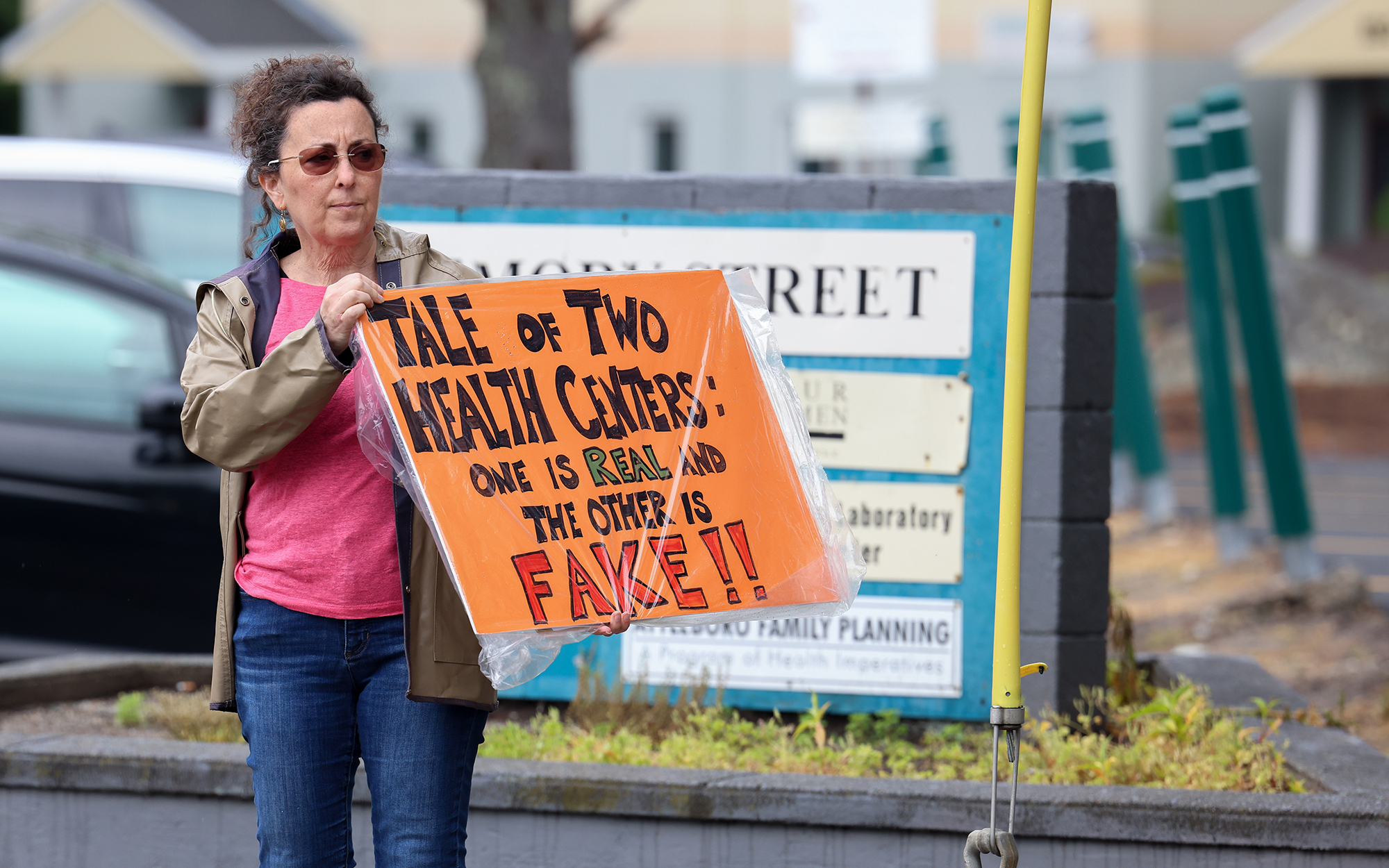 Laurie Veninger, with Indivisible Mass Coalition, demonstrates outside Abundant Hope Pregnancy Resource Center during an open house at the anti-abortion counseling center on June 17, 2023. The center in Attleboro, Massachusetts, is located next to an abortion clinic. (Photo by Trilce Estrada Olvera/News21)