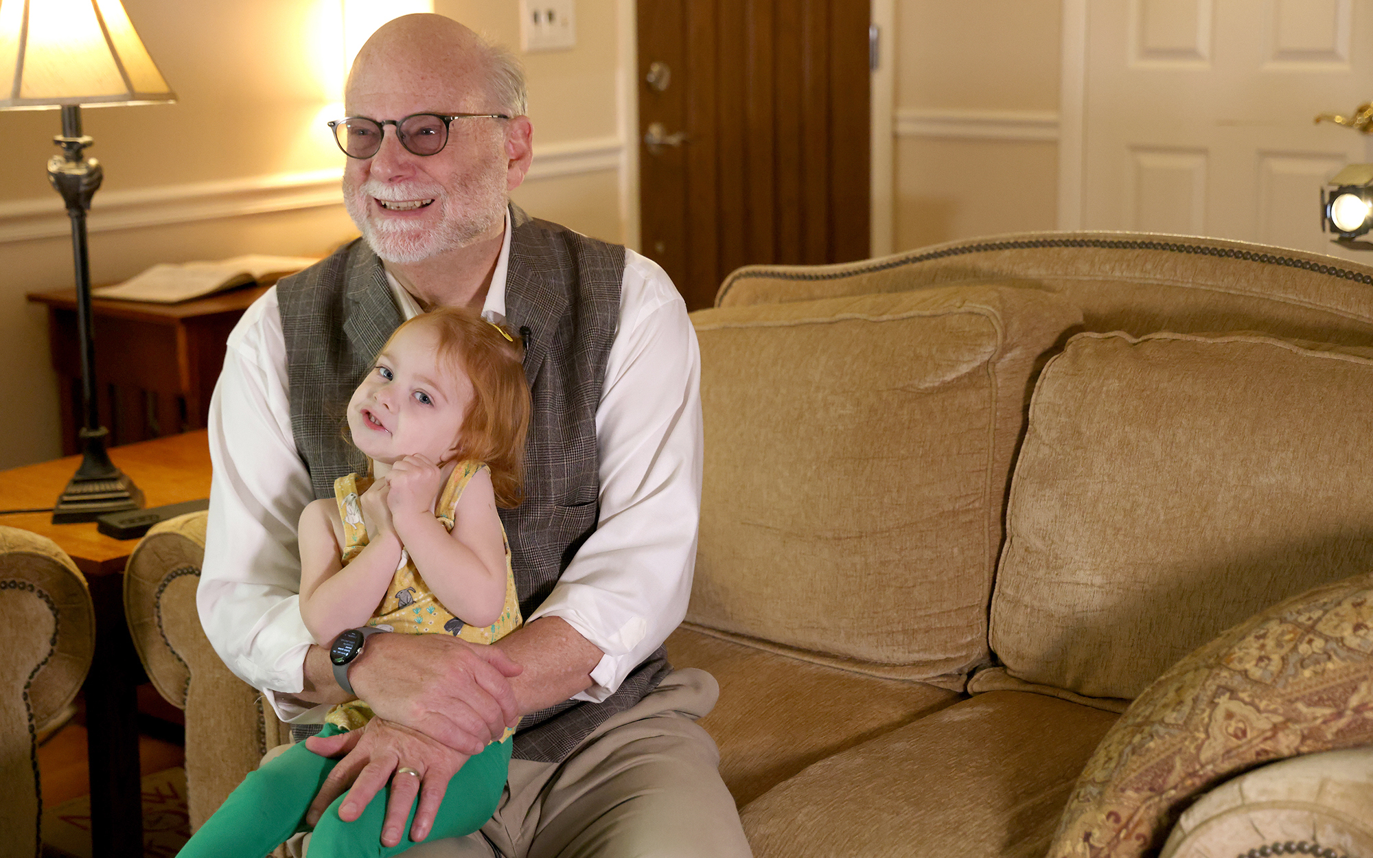 Rev. Bill Levering holds his daughter, Valerie, at his home in Schenectady, N.Y., on June 17, 2023. Valerie was conceived via in vitro fertilization, which, along with abortion and other health care services, is prohibited at Catholic-run hospitals. (Photo by Morgan Casey/News21)