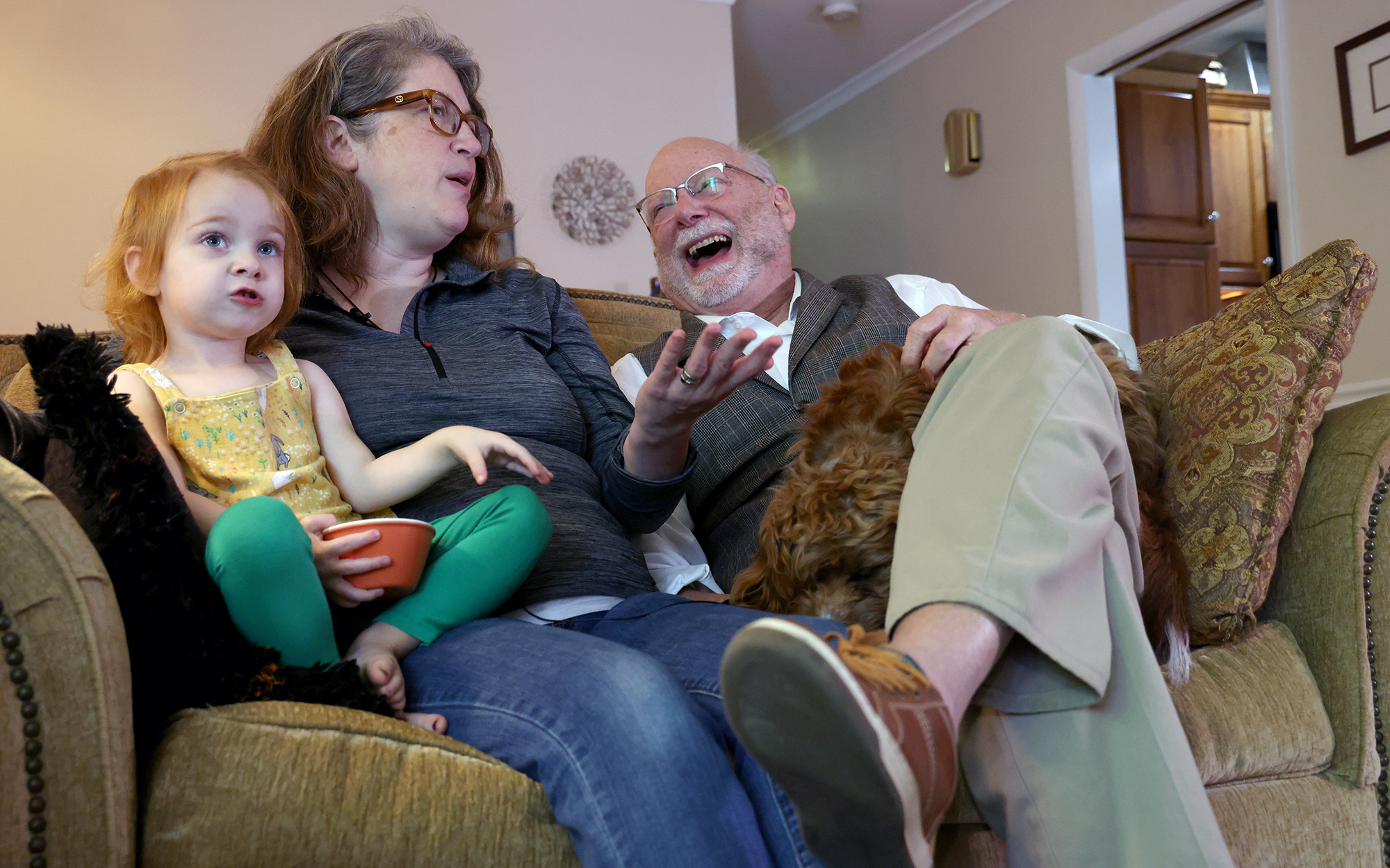 Rev. Bill Levering, right, enjoys a moment with his wife, Abby, and daughter, Valerie. Levering and other Schenectady residents are fighting a proposed merger between a Catholic health care system and their local hospital amid worries they’ll lose access to services. (Photo by Morgan Casey/News21)