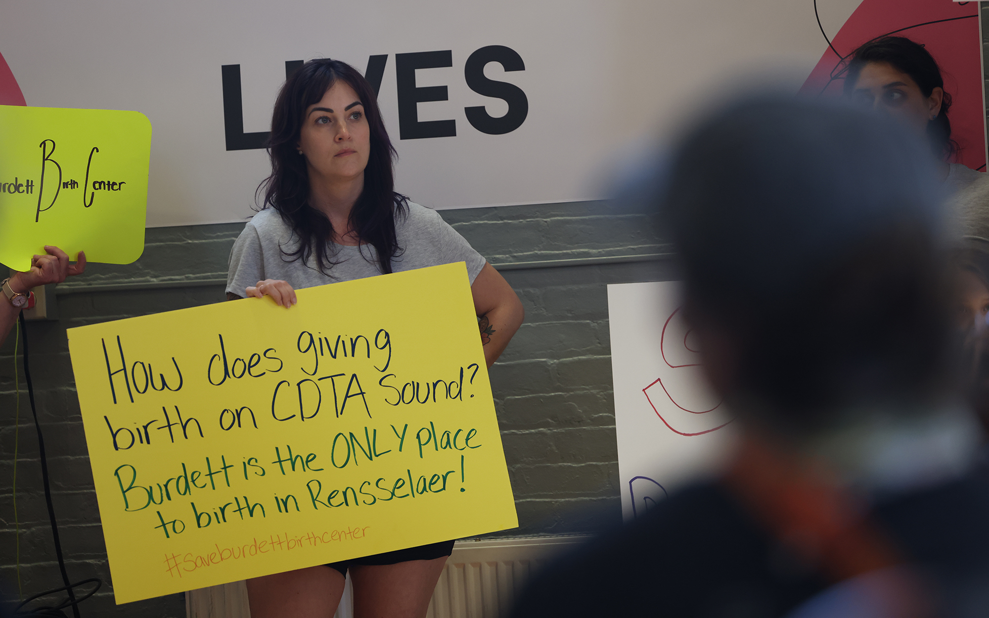 Victoria Kereszi, a postpartum doula, protests the proposed closure of Burdett Birth Center at a rally on June 20, 2023 in Troy, N.Y. (Photo by Morgan Casey/News21)