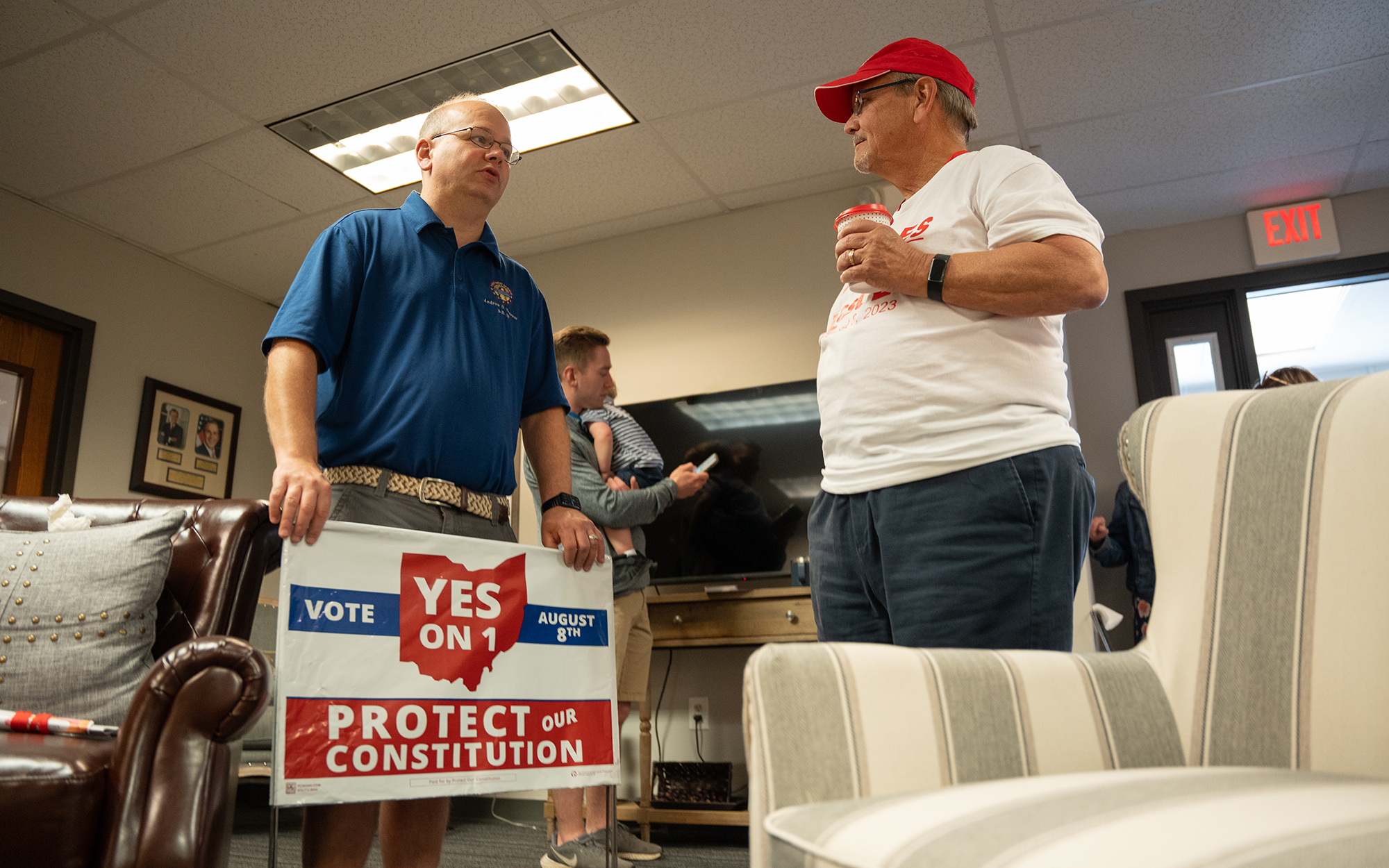 Ohio state Sen. Andrew Brenner, R-Delaware, left, speaks with resident Scott McVicker during a June 24, 2023, event at the GOP headquarters in Delaware, Ohio, to celebrate the anniversary of the Supreme Court decision that overturned Roe v. Wade. (Photo by Mingson Lau/News21)